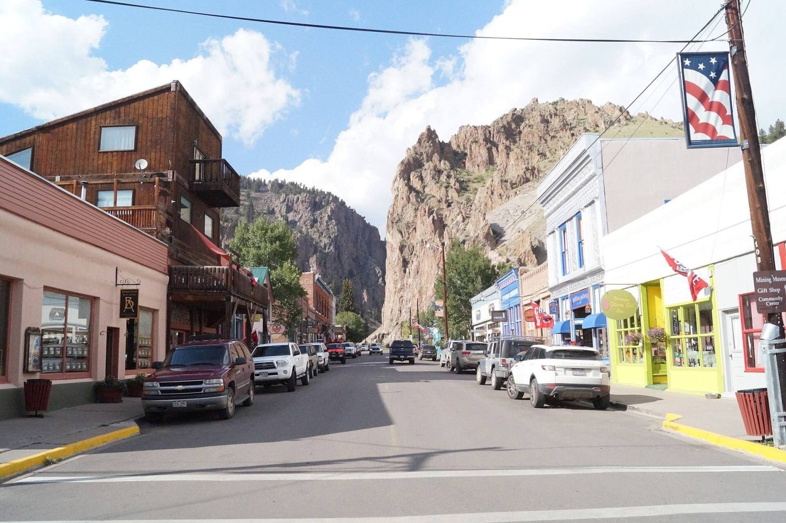 Main Street in Creede, Colorado, with the cliffs of Willow Creek Canyon rising behind the town