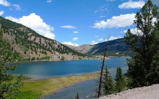 Lake San Cristobal surrounded by forested mountains near Lake City