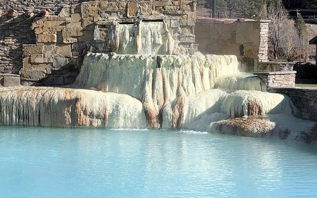 Mineral terraces and blue water at the Mother Spring in Pagosa Springs
