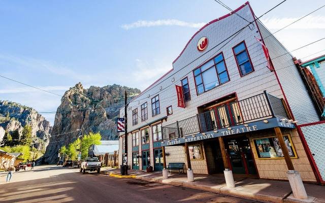 The Creede Repertory Theatre Mainstage on Main Street with cliffs behind