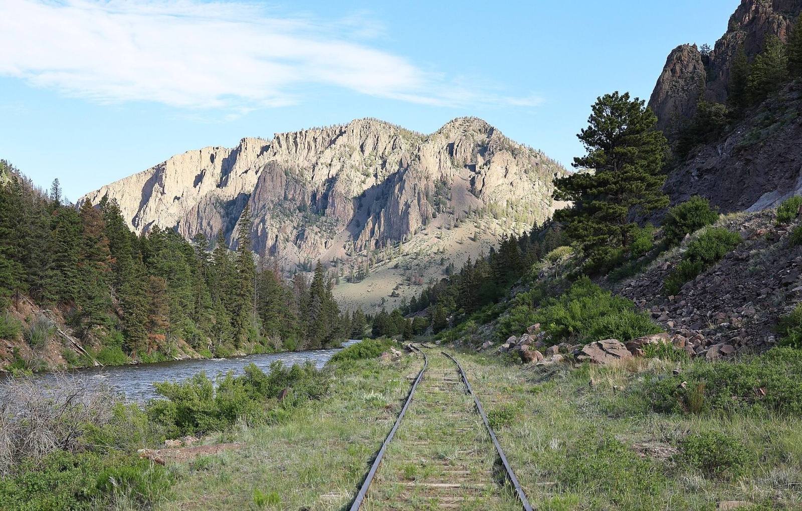 The old railroad grade of the Creede Branch running beside the Rio Grande below cliffs