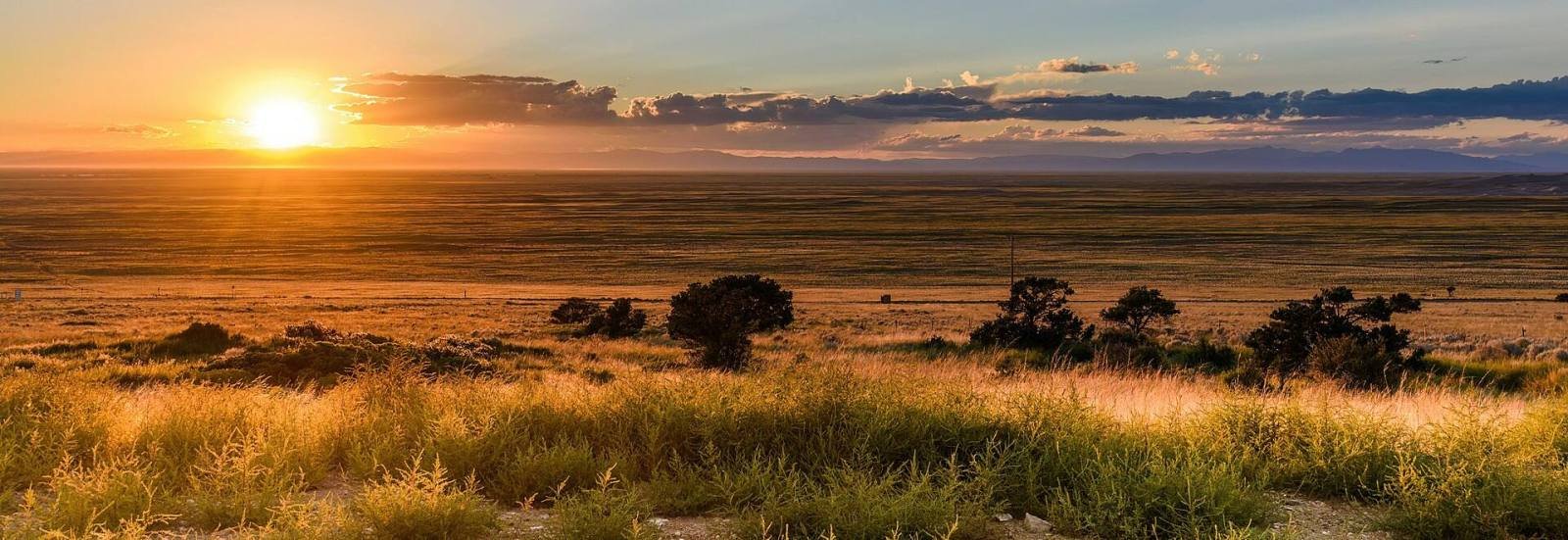 The sun setting over the San Luis Valley near Great Sand Dunes National Park