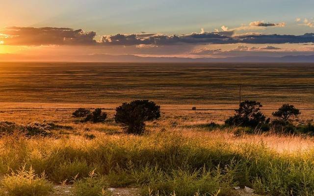 The sun setting over the San Luis Valley near Great Sand Dunes National Park